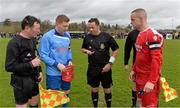 29 March 2015; Referee Gary Fitzgerald performs the coin-toss in the company of North End Utd captain Paul Murphy and Moyross Utd captain Keith Colbert. Aviva FAI Junior Cup, Quarter-Final, Moyross Utd v North End Utd. Moyross, Limerick. Picture credit: Diarmuid Greene / SPORTSFILE