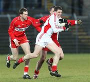 5 April 2008; Colin Holmes, Tyrone, in action against Enda Muldoon and James Conway, Derry. Allianz National Football League, Division 1, Round 6, Derry v Tyrone, Celtic Park, Derry. Picture credit: Oliver McVeigh / SPORTSFILE