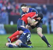 12 April 2008; Denis Leamy, Munster, is tackled by Jonathan Sexton, 10, and Malcolm O'Kelly, Leinster. Magners League, Leinster v Munster, RDS, Ballsbridge, Dublin. Picture credit: Brendan Moran / SPORTSFILE