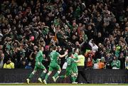 29 March 2015; Republic of Ireland's Shane Long, right, celebrates with team-mates, from left to right, James McClean, Seamus Coleman and Wesley Hoolahan after scoring his side's equalising goal. UEFA EURO 2016 Championship Qualifier, Group D, Republic of Ireland v Poland. Aviva Stadium, Lansdowne Road, Dublin. Picture credit: Ramsey Cardy / SPORTSFILE