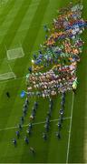 30 March 2015; A general view of children parading around the pitch at Croke Park, led by the Artane Band, during the opening day of the National Go Games. Croke Park, Dublin Picture credit: David Maher / SPORTSFILE