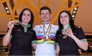 30 March 2015; Ireland's bronze medallists Eve McCrystal, Dundalk, Co. Louth, and Katie-George Dunlevy, Maidenhead, Great Britain, with world champion and bronze medalist Eoghan Clifford, Galway, pictured on the teams arrival home after the 2015 UCI Para-cycling Track World Championships in The Netherlands. Dublin Airport, Dublin. Picture credit: Pat Murphy / SPORTSFILE