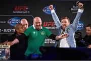 31 March 2015; UFC featherweight Conor McGregor, right, is restrained by UFC President Dana White from UFC featherweight Champion Jose Aldo during a fan event. The Convention Centre Dublin, Spencer Dock, North Wall Quay, Dublin. Picture credit: Ramsey Cardy / SPORTSFILE