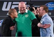 31 March 2015; UFC featherweight Champion Jose Aldo, left, faces off against UFC featherweight title challenger Conor McGregor as UFC President Dana White tries to separate them during a UFC fan event. The Convention Centre Dublin, Spencer Dock, North Wall Quay, Dublin. Picture credit: Ramsey Cardy / SPORTSFILE