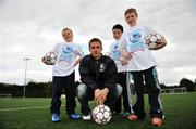 9 April 2008; At the launch of the 2008 Danone Nations Cup are Ireland's &quot;Godfather&quot; Kevin Doyle with, from left, Robert Martin, age 11, Shane Howard, age 11, and Liam Scully, age 11. The Danone Nations Cup is the world's top football tournament for children aged 10-12. This years World Finals will see over 600 players from the 40 participating countries come together in Parc De Prince, Paris from the 5-7th September. The event is based on four fundamental values: openness, pleasure of the game, fair-play and accessibility. This years World finals take place in Parc De Prince Paris in September. Ireland's National Final takes place in June. Oscar Traynor Complex, Oscar Traynor Road, Coolock, Dublin. Picture credit: Brian Lawless / SPORTSFILE