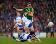 29 March 2015; Paul O'Donoghue, Kerry, has his shot blocked by Karl O'Connell, Monaghan. Allianz Football League, Division 1, Round 6, Kerry v Monaghan. Austin Stack Park, Tralee, Co. Kerry. Picture credit: Stephen McCarthy / SPORTSFILE