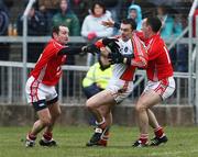 20 April 2008; Oisin McConville, Armagh, in action against Sean O'Brien and Kieran O'Connor, Cork. Allianz National Football League, Division 2, Round 7, Armagh v Cork, St Oliver Plunkett Park, Crossmaglen, Co. Armagh. Picture credit: Oliver McVeigh / SPORTSFILE