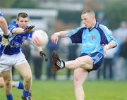 22 April 2008; Paddy Cunningham, UUJ, kicks over a point despite the tackle of Ciaran McGrath, Garda College. Ulster Bank Sigerson Cup Final, Garda College v UUJ, Carlow IT Grounds, Carlow. Picture credit: Matt Browne / SPORTSFILE