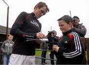 5 April 2015; Jockey Tony McCoy signs an autograph for Donal O'Neill, from Skibbereen, Co. Cork, before the start of today's racing. Fairyhouse Easter Festival, Fairyhouse, Co. Meath. Picture credit: Pat Murphy / SPORTSFILE