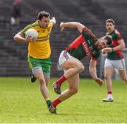 5 April 2015; Martin McElhinney, Donegal, in action against Seamus O'Shea, Mayo. Allianz Football League, Division 1, Round 7, Mayo v Donegal. Elverys MacHale Park, Castlebar, Co. Mayo. Picture credit: David Maher / SPORTSFILE