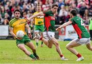 5 April 2015; Ryan McHugh, Donegal, in action against Lee Keegan, centre, and Keith Higgins, Mayo. Allianz Football League, Division 1, Round 7, Mayo v Donegal. Elverys MacHale Park, Castlebar, Co. Mayo. Picture credit: David Maher / SPORTSFILE