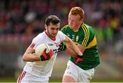 5 April 2015; Ryan McKenna, Tyrone, in action against Johnny Buckley, Kerry. Allianz Football League, Division 1, Round 7, Tyrone v Kerry. Healy Park, Omagh, Co. Tyrone. Picture credit: Stephen McCarthy / SPORTSFILE