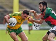 5 April 2015; Martin O'Reilly, Donegal, in action against Kevin McLoughlin, Mayo. Allianz Football League, Division 1, Round 7, Mayo v Donegal. Elverys MacHale Park, Castlebar, Co. Mayo. Picture credit: David Maher / SPORTSFILE