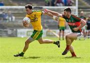 5 April 2015; Martin McElhinney, Donegal, in action against Seamus O'Shea, Mayo. Allianz Football League, Division 1, Round 7, Mayo v Donegal. Elverys MacHale Park, Castlebar, Co. Mayo. Picture credit: David Maher / SPORTSFILE