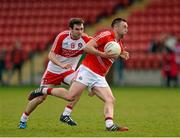 5 April 2015; Paul Kerrigan, Cork, in action against Benny Heron, Derry. Allianz Football League, Division 1, Round 7, Derry v Cork. Owenbeg, Derry. Picture credit: Oliver McVeigh / SPORTSFILE
