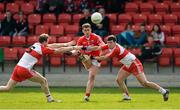 5 April 2015; Fintan Goold, Cork, in action against Liam McGoldrick and Daniel Heavron, Derry. Allianz Football League, Division 1, Round 7, Derry v Cork. Owenbeg, Derry. Picture credit: Oliver McVeigh / SPORTSFILE