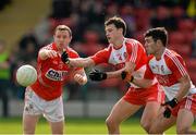 5 April 2015; Kevin Johnston and Daniel Heavron, Derry, in action against John Hayes, Cork. Allianz Football League, Division 1, Round 7, Derry v Cork. Owenbeg, Derry. Picture credit: Oliver McVeigh / SPORTSFILE