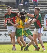 5 April 2015; Mark and Ryan McHugh, Donegal, tussles with  Mayo's Kevin Keane and Lee Keegan, at the end of the game after their team-mate Stephen Griffen, had scored a point resulting in Donegal reaching the Allianz Football League, Division 1 semi final. Allianz Football League, Division 1, Round 7, Mayo v Donegal. Elverys MacHale Park, Castlebar, Co. Mayo. Picture credit: David Maher / SPORTSFILE