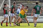 5 April 2015; Mark and Ryan McHugh, Donegal, tussles with  Mayo's Kevin Keane and Neil Douglas, at the end of the game after his team-mate Stephen Griffen, had scored a point resulting in Donegal reaching the Allianz Football League, Division 1 semi final. Allianz Football League, Division 1, Round 7, Mayo v Donegal. Elverys MacHale Park, Castlebar, Co. Mayo. Picture credit: David Maher / SPORTSFILE