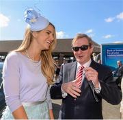 6 April 2015; An Taoiseach Enda Kenny T.D. with Vogue Williams, judge of the most stylish lady competition, on arrival before the start of the days racing. Fairyhouse Easter Festival, Fairyhouse, Co. Meath. Picture credit: Pat Murphy / SPORTSFILE