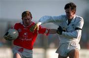 1 February 1998; Aidan Dorgan of Cork in action against Brian Lacey of Kildare during the Church & General National Football League match between Kildare and Cork at St Conleth's Park in Newbridge, Kildare. Photo by Ray McManus/Sportsfile