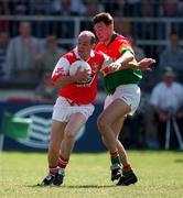 1 June 1997; Alan Rooney of Louth in action against Sean Kavanagh of Carlow during the Leinster GAA Senior Football Championship Quarter-Final match between Louth and Carlow at St Conleth's Park, Newbridge, Kildare. Photo by Brendan Moran/Sportsfile