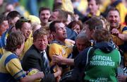 14 September 1997; Anthony Daly of Clare celebrates with supporters after the Guinness All Ireland Hurling Final match between Clare and Tipperary at Croke Park in Dublin. Photo by Matt Browne/Sportsfile