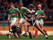15 February 1998; Barry Whelahan of Birr, supported by his brother, Brian, left, in action against, Daniel Scanlan of Clarecastle, on ground, and Kenneth Morrissey during the AIB All-Ireland Club Hurling Championship Semi-Final match between Birr and Clarecastle at Semple Stadium in Thurles Tipperary. Photo by Ray McManus/Sportsfile