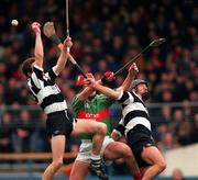 15 February 1998; Gary Cahill of Birr in action against Robert Fitzgerald, left, and Kenneth Morrissey of Clarecastle during the AIB All-Ireland Club Hurling Championship Semi-Final match between Birr and Clarecastle at Semple Stadium in Thurles Tipperary. Photo by Ray McManus/Sportsfile