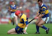 14 September 1997; Brian Lohan of Clare in action against Michael Cleary of Tipperary during the GAA Munster Senior Hurling Championship Final match between Clare and Tipperary at Páirc Uí Chaoimh, Cork. Photo by Ray McManus/Sportsfile *** Local Caption ***