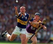 17 August 1997; Brian O'Meara of Tipperary in action against Colm Kehoe of Wexford during the GAA All-Ireland Senior Hurling Championship Semi-Final match between Tipperary and Wexford at Croke Park in Dublin. Photo by Ray McManus/Sportsfile