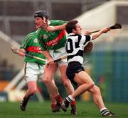 15 February 1998; Brian Whelehan of Birr evades the tackle of Robert Fitzgerald of Clarecastle during the AIB All-Ireland Club Hurling Championship Semi-Final match between Birr and Clarecastle at Semple Stadium in Thurles Tipperary. Photo by Ray McManus/Sportsfile