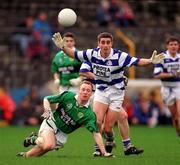 22 February 1998; Martin Naughton of Erin's Isle in action against Colin Crowley of Castlehaven during the AIB All-Ireland Club Senior Football Semi-Final match between Erin's Isle and Castlehaven at Semple Stadium in Thurles, Tipperary. Photo by Ray McManus/Sportsfile