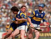 14 September 1997; Colin Lynch of Clare in action against Michael Ryan and Conor Gleeson of Tipperary during the GAA Munster Senior Hurling Championship Final match between Clare and Tipperary at Páirc Uí Chaoimh, Cork. Photo by Ray McManus/Sportsfile *** Local Caption ***