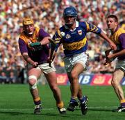 17 August 1997; Colm Bonnar of Tipperary in action against Garry Laffan of Wexford during the GAA All-Ireland Senior Hurling Championship Semi-Final match between Tipperary and Wexford at Croke Park in Dublin. Photo by David Maher/Sportsfile