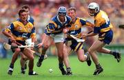 14 September 1997; Conal Bonnar of Tipperary in action against P.J O'Connell, James O'Connor and Ger O'Loughlin of Clare during the Guinness All Ireland Hurling Final match between Clare and Tipperary at Croke Park in Dublin. Photo by Ray McManus/Sportsfile