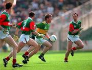 11 August 1996; Dara O'Cinnéide of Kerry in action against Mayo players, from left, James Nallen, Kenneth Mortimer and Dermot Flanagan during the GAA All-Ireland Senior Football Championship Semi-Final match between Mayo and Kerry at Croke Park in Dublin. Photo by Brendan Moran/Sportsfile
