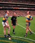 14 September 1997; Referee Dickie Murphy performs the coin toss between Tipperary captain Conor Gleeson, left, and Clare captain Anthony Daly prior to the Guinness All Ireland Hurling Final match between Clare and Tipperary at Croke Park in Dublin. Photo by David Maher/Sportsfile