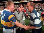 14 September 1997; Clare manager Ger Loughnane, alongside RTE's Brian Carthy, is congratulated by Aidan Ryan of Tipperary after the Guinness All Ireland Hurling Final match between Clare and Tipperary at Croke Park in Dublin. Photo by Ray McManus/Sportsfile