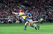 14 September 1997; John Leahy of Tipperary has a shot on goal in the final moments of the game despite the attempts of Brian Lohan of Clare during the Guinness All Ireland Hurling Final match between Clare and Tipperary at Croke Park in Dublin. Photo by David Maher/Sportsfile