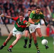 11 August 1996; Maurice Fitzgerald of Kerry in action against James Nallen of Mayo during the GAA All-Ireland Senior Football Championship Semi-Final match between Mayo and Kerry at Croke Park in Dublin. Photo by Brendan Moran/Sportsfile