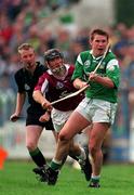 5 October 1997; Mark Foley of Limerick in action againstCathal Moore of Galway during the National Hurling League Final between Limerick and Galway at Cusack Park in Ennis, Clare. Photo by Ray McManus/Sportsfile