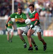 11 August 1996; Noel Connelly of Mayo in action against Mike Hassett of Kerry during the GAA All-Ireland Senior Football Championship Semi-Final match between Mayo and Kerry at Croke Park in Dublin. Photo by Brendan Moran/Sportsfile