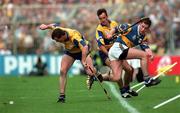 14 September 1997; Ollie Baker of Clare in action against Liam McGrath of Tipperary during the Guinness All Ireland Hurling Final match between Clare and Tipperary at Croke Park in Dublin. Photo by David Maher/Sportsfile