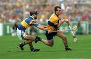 14 September 1997; Ollie Baker of Clare in action against Tommy Dunne of Tipperary during the Guinness All-Ireland Senior Hurling Championship Final between Clare and Tipperary at Croke Park in Dublin. Photo by David Maher/Sportsfile