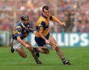 14 September 1997; Ollie Baker of Clare in action against Tommy Dunne of Tipperary during the Guinness All Ireland Hurling Final match between Clare and Tipperary at Croke Park in Dublin. Photo by David Maher/Sportsfile