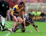 14 September 1997; Ollie Baker of Clare in action against Tommy Dunne of Tipperary during the Guinness All Ireland Hurling Final match between Clare and Tipperary at Croke Park in Dublin. Photo by Ray McManus/Sportsfile