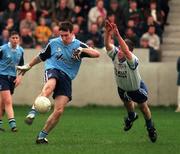 15 February 1998; Paddy Christie of Dublin clears downfield despite the attempts of Darren Swift of Monaghan during the Church & General National Football League match between Dublin and Monaghan at Parnell Park in Dublin. Photo by Brendan Moran/Sportsfile