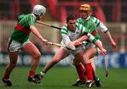 17 March 1998; Peter Kelly of Sarsfields in action against Gareth Doorley, left, and Niall Claffrey of Birr during the All-Ireland Club Hurling Final between Sarsfields and Birr at Croke Park, Dublin. Photo by Brendan Moran/Sportsfile