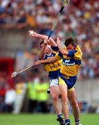 6 July 1997; Raymie Ryan of Tipperary in action against PJ O'Connell of Clare during the GAA Munster Senior Hurling Championship Final match between Clare and Tipperary at Páirc Uí Chaoimh in Cork. Photo by Ray McManus/Sportsfile